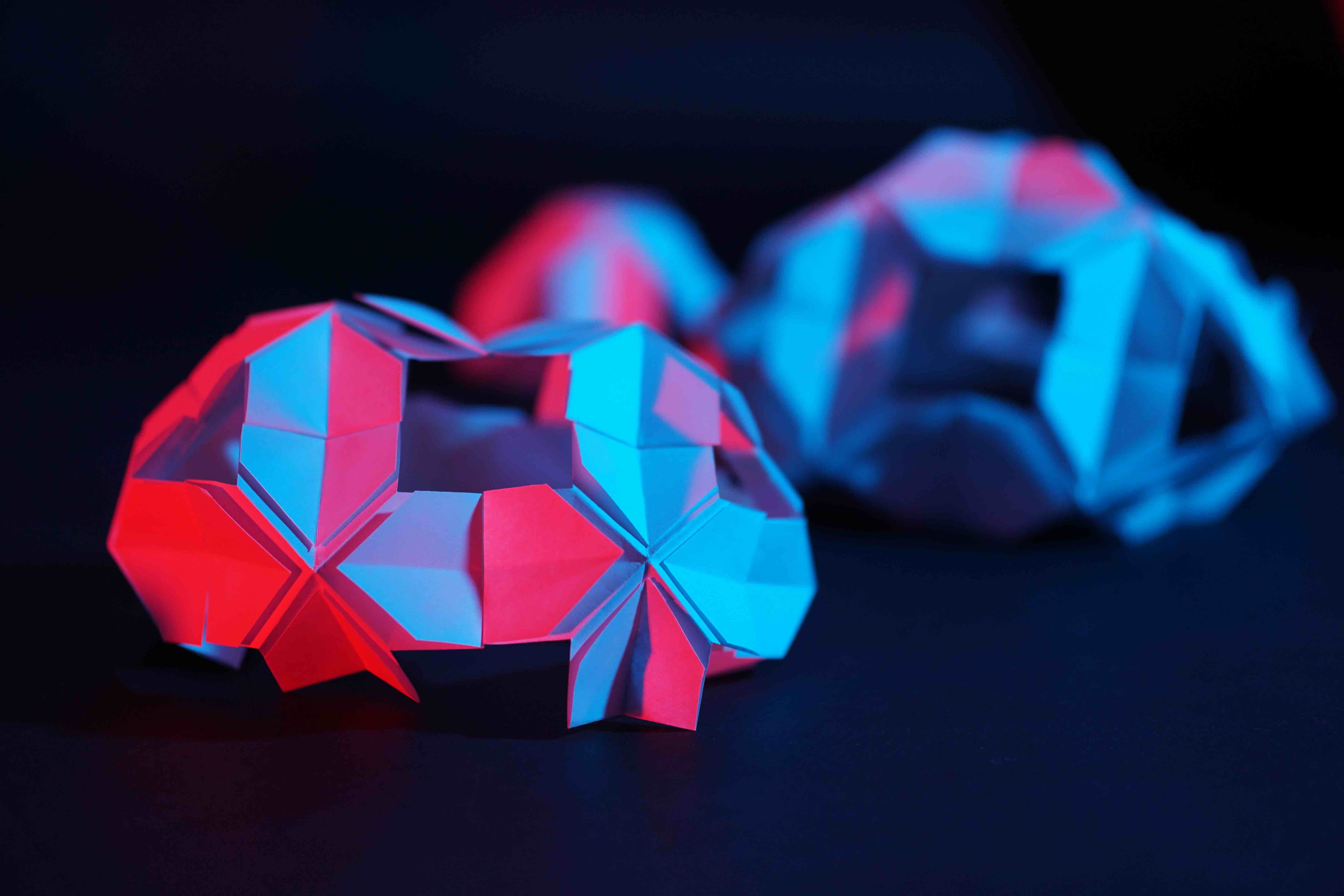 The folded paper structure — repetition, balance, and structural variation